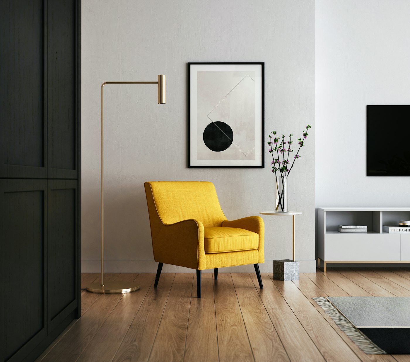 A warmly lit modern living room with a yellow accent armchair, framed geometric wall art, and polished wood flooring — the kind of finished interior a design studio presents to a client